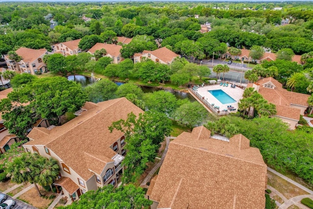 birds eye view of property with a water view and a residential view