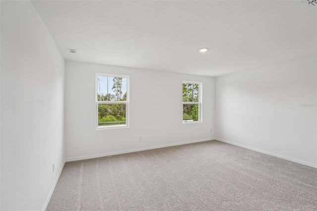 2467 Zuni Rd, Saint Cloud, FL 34771 - unfurnished room featuring carpet flooring, baseboards, recessed lighting, and a smoke detector
