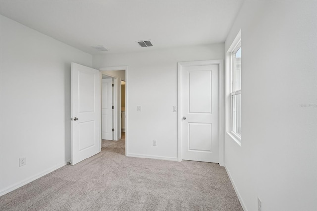 2467 Zuni Rd, Saint Cloud, FL 34771 - unfurnished bedroom with carpet floors and baseboards