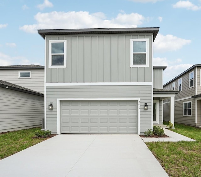 2467 Zuni Rd, Saint Cloud, FL 34771 - view of front facade with board and batten siding, concrete driveway, and a garage
