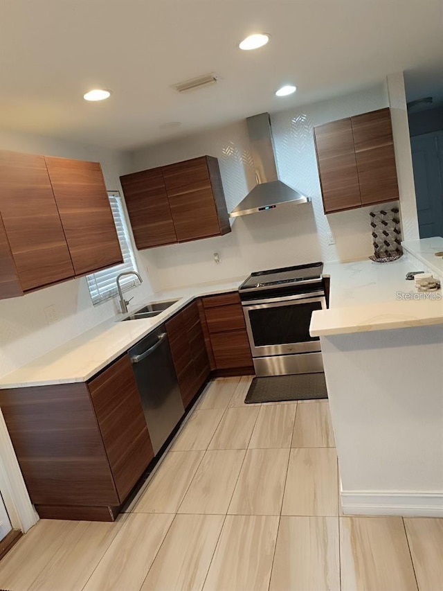 631 Trailwood Dr, Altamonte Springs, FL 32714 - kitchen featuring wall chimney range hood, appliances with stainless steel finishes, modern cabinets, a sink, and light countertops