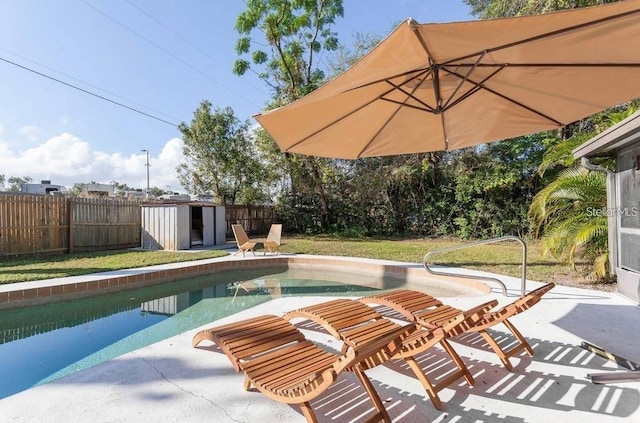 631 Trailwood Dr, Altamonte Springs, FL 32714 - view of swimming pool with a fenced in pool, an outdoor structure, a shed, a fenced backyard, and a patio