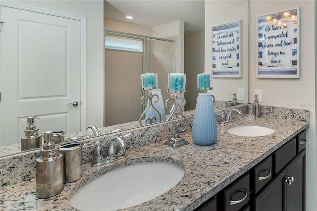1820 Summer Dr, Davenport, FL 33897 - bathroom with a sink, a shower stall, recessed lighting, and double vanity