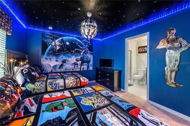 1820 Summer Dr, Davenport, FL 33897 - carpeted bedroom with baseboards and ensuite bath