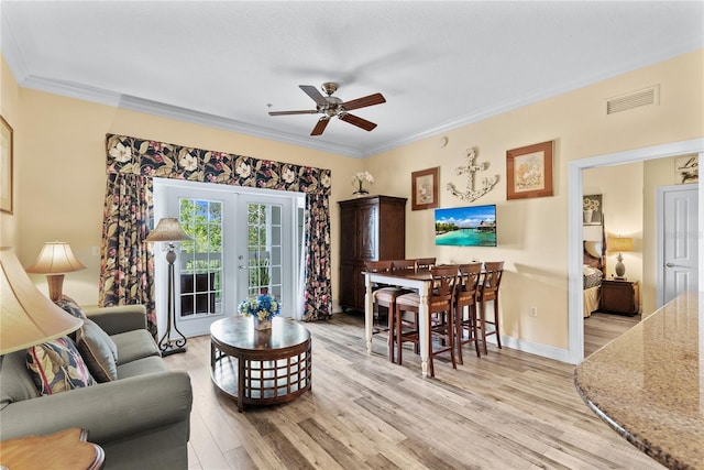 7630 Heritage Crossing Way Unit 302, Reunion, FL 34747 - living room with ceiling fan, wood finished floors, ornamental molding, french doors, and baseboards
