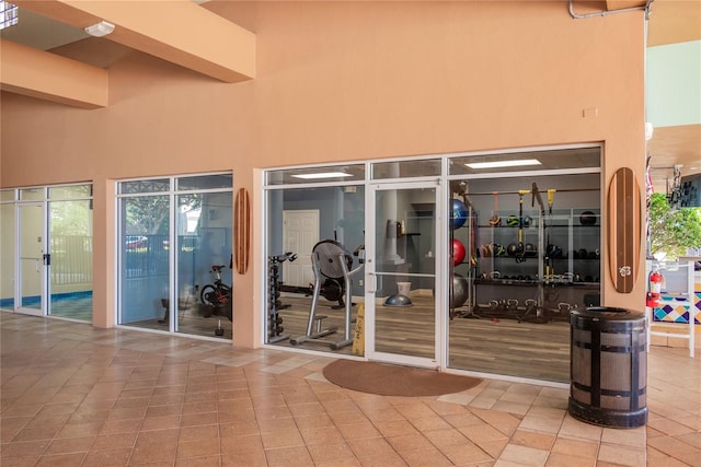 7630 Heritage Crossing Way Unit 302, Reunion, FL 34747 - doorway to property featuring stucco siding