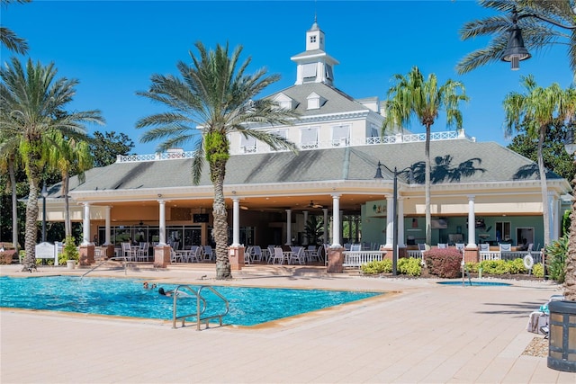 7630 Heritage Crossing Way Unit 302, Reunion, FL 34747 - community pool featuring a patio area