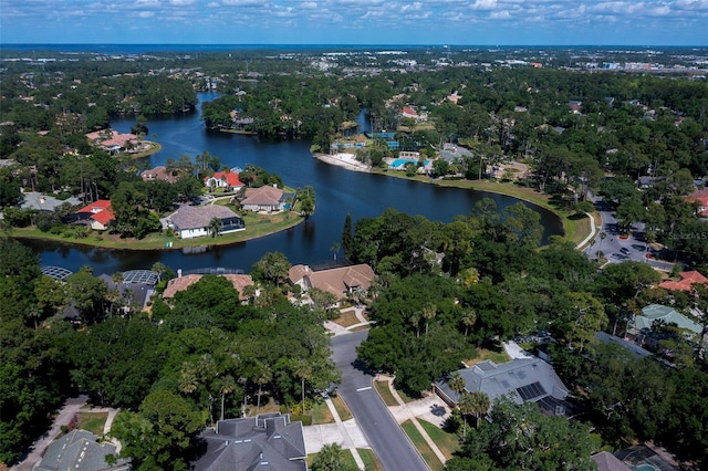 drone / aerial view featuring a water view and a residential view