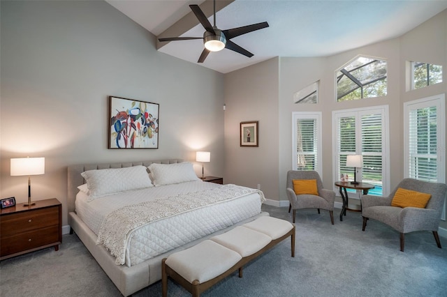 bedroom with light carpet, baseboards, a ceiling fan, and high vaulted ceiling