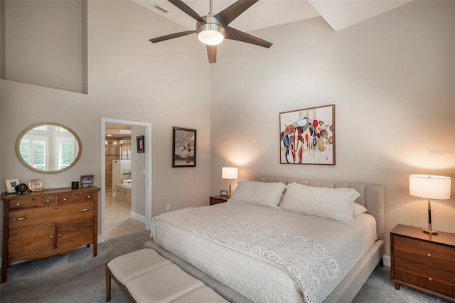 bedroom with carpet, high vaulted ceiling, ensuite bathroom, visible vents, and baseboards