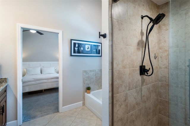 ensuite bathroom featuring ensuite bathroom, vanity, tile patterned flooring, a garden tub, and tiled shower