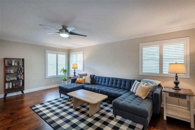 living area featuring crown molding, a ceiling fan, and dark wood finished floors