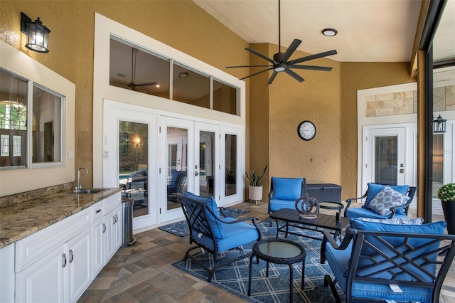 view of patio featuring an outdoor hangout area, french doors, ceiling fan, and a sink
