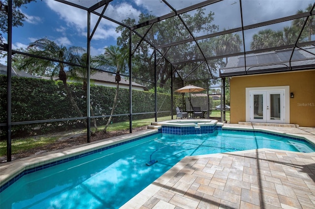 view of swimming pool with a patio, french doors, and a lanai