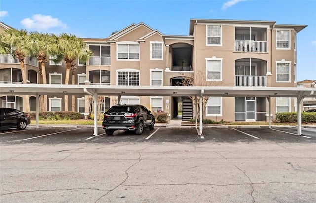 7147 Yacht Basin Ave Unit 119, Orlando, FL 32835 - view of property with covered parking