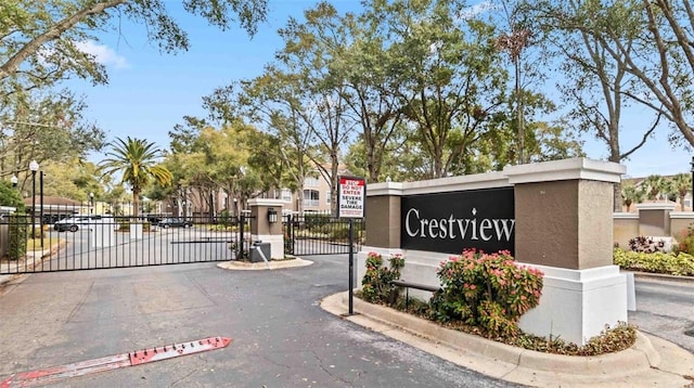 7147 Yacht Basin Ave Unit 119, Orlando, FL 32835 - community sign featuring fence and a gate