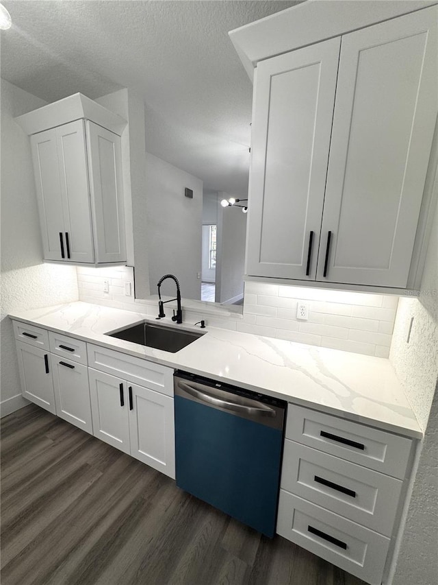 7147 Yacht Basin Ave Unit 119, Orlando, FL 32835 - kitchen with a sink, decorative backsplash, dishwashing machine, and dark wood finished floors