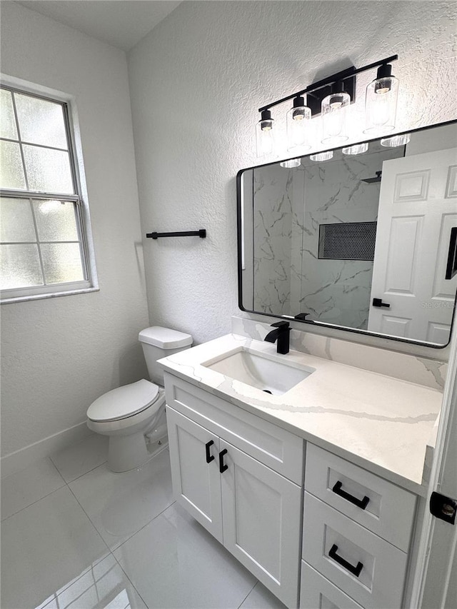7147 Yacht Basin Ave Unit 119, Orlando, FL 32835 - bathroom with toilet, marble finish floor, vanity, and a textured wall