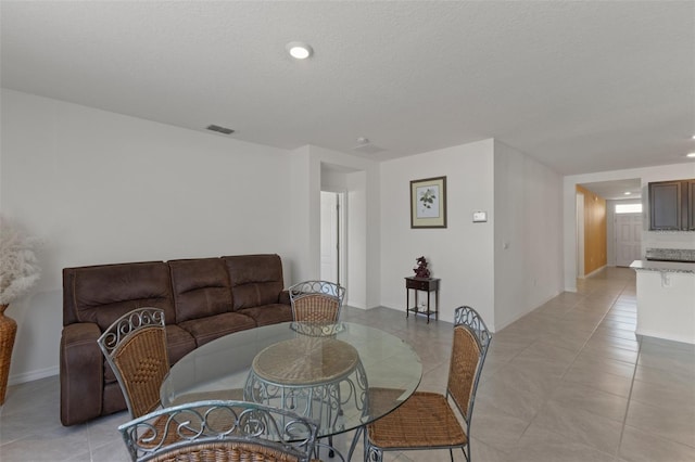 dining room with light tile patterned floors, baseboards, recessed lighting, and visible vents