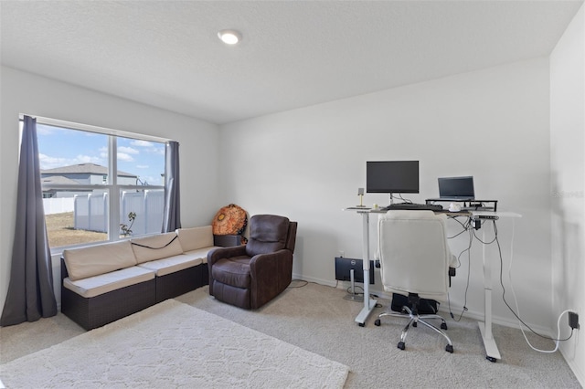 home office featuring carpet floors and baseboards