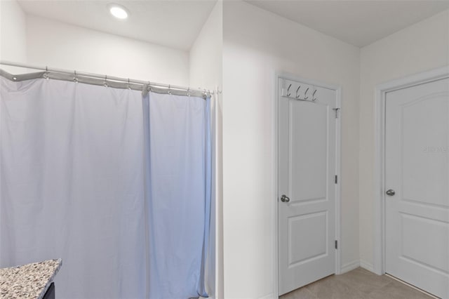 full bath featuring a shower with curtain, tile patterned floors, baseboards, and recessed lighting