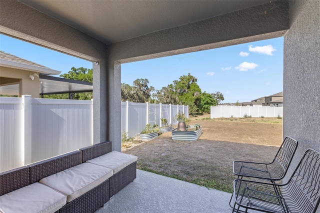 view of patio / terrace featuring fence