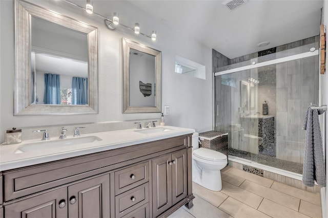 440 E Crystal Lake St, Orlando, FL 32806 - bathroom featuring visible vents, a sink, a stall shower, and toilet