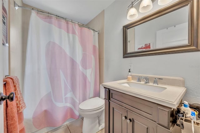 440 E Crystal Lake St, Orlando, FL 32806 - full bath with vanity, a shower with shower curtain, tile patterned flooring, and toilet