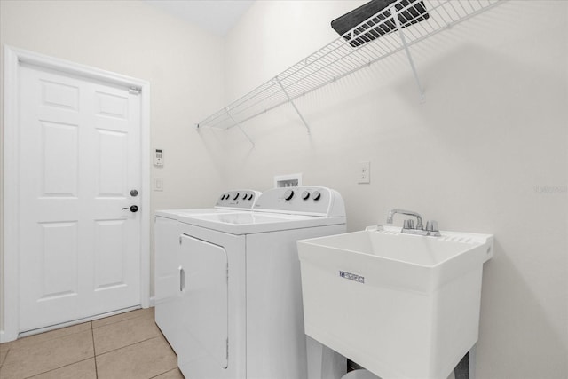 16780 Meadows St, Clermont, FL 34714 - laundry area featuring washer and dryer and light tile patterned flooring