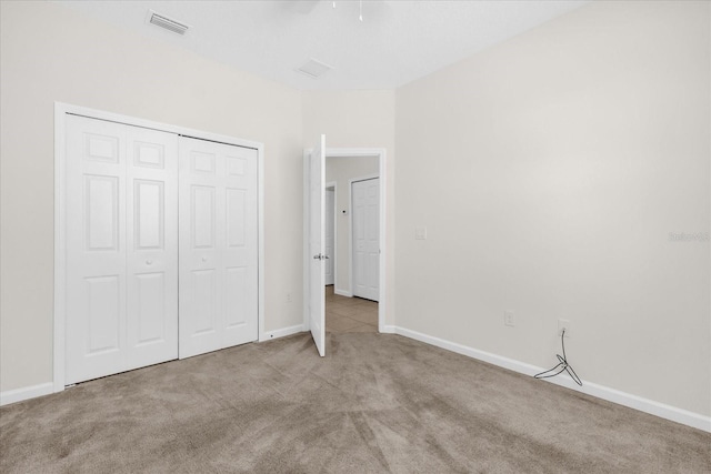 16780 Meadows St, Clermont, FL 34714 - unfurnished bedroom featuring carpet floors, a closet, and baseboards