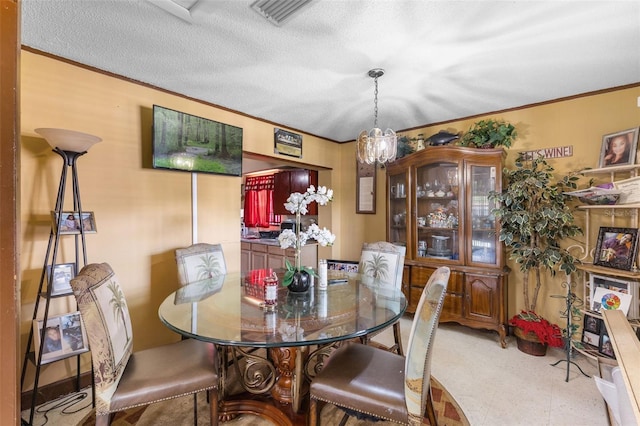 dining area with visible vents and crown molding