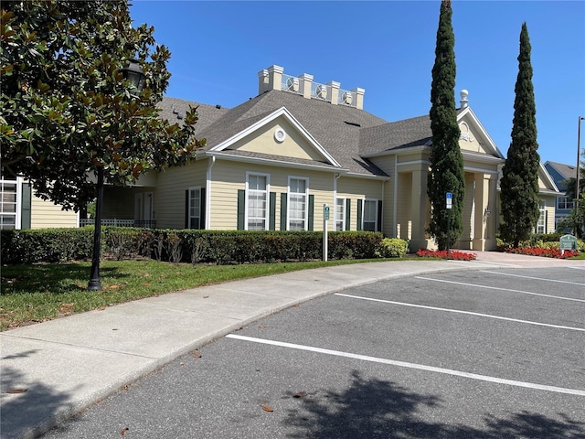 view of property with uncovered parking