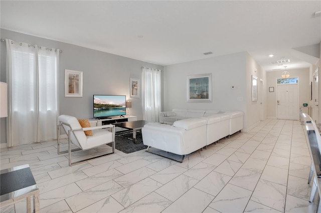 9034 Stinger Dr, Davenport, FL 33896 - living area with visible vents and marble finish floor