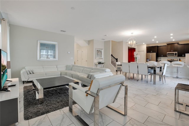 9034 Stinger Dr, Davenport, FL 33896 - living room with visible vents, stairway, marble finish floor, a notable chandelier, and recessed lighting