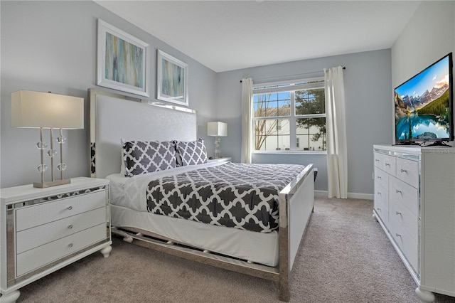 9034 Stinger Dr, Davenport, FL 33896 - bedroom featuring baseboards and light carpet
