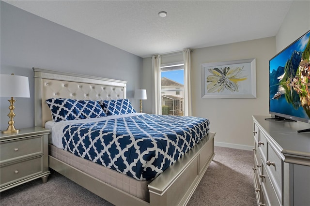 9034 Stinger Dr, Davenport, FL 33896 - bedroom with a textured ceiling, baseboards, and dark carpet