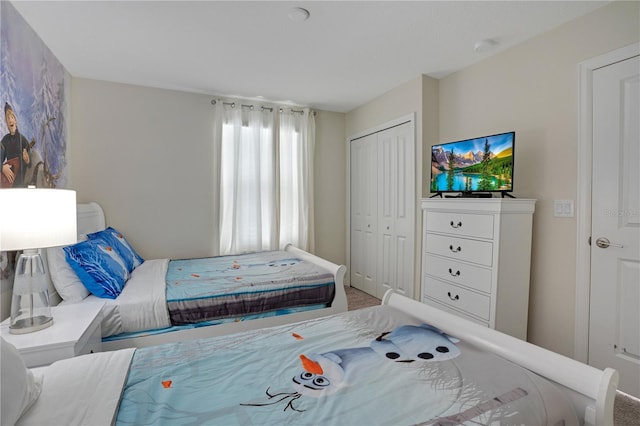 9034 Stinger Dr, Davenport, FL 33896 - bedroom featuring a closet and carpet flooring