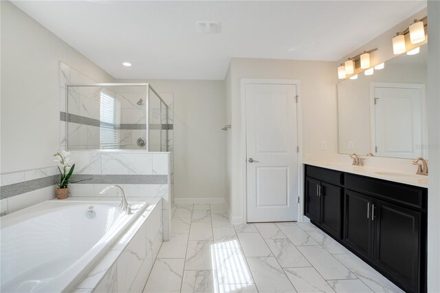 9034 Stinger Dr, Davenport, FL 33896 - bathroom featuring double vanity, a garden tub, a shower stall, a sink, and marble finish floor
