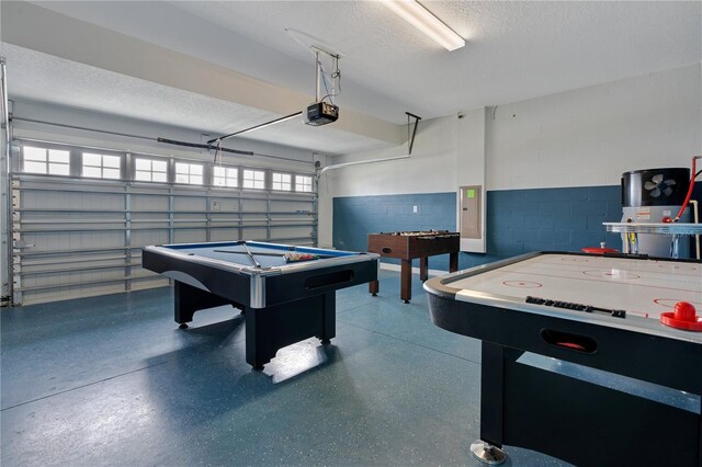 9034 Stinger Dr, Davenport, FL 33896 - playroom with a garage, a textured ceiling, speckled floor, pool table, and concrete block wall