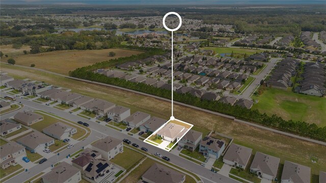 bird's eye view with a residential view and a water view