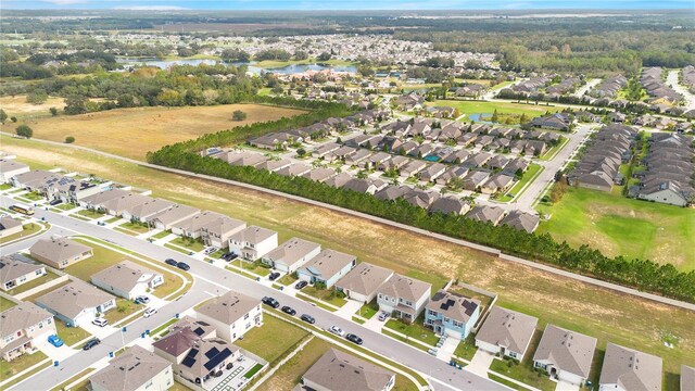 birds eye view of property featuring a residential view and a water view