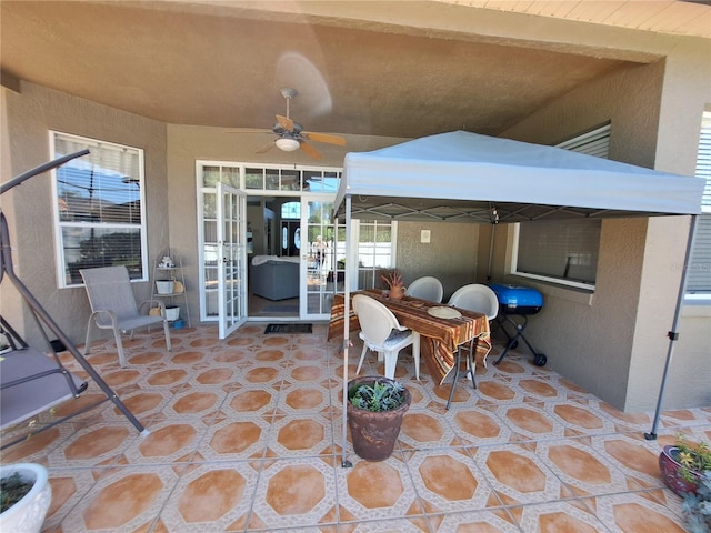 view of patio featuring ceiling fan