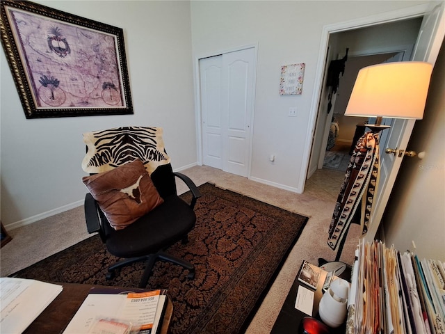 living area with baseboards and carpet flooring