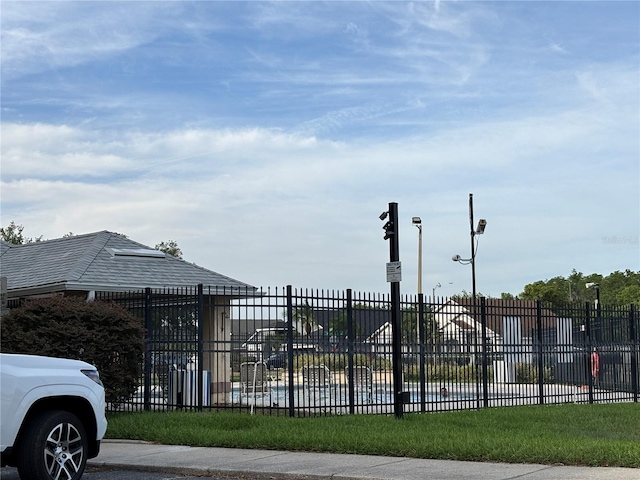 view of gate with fence