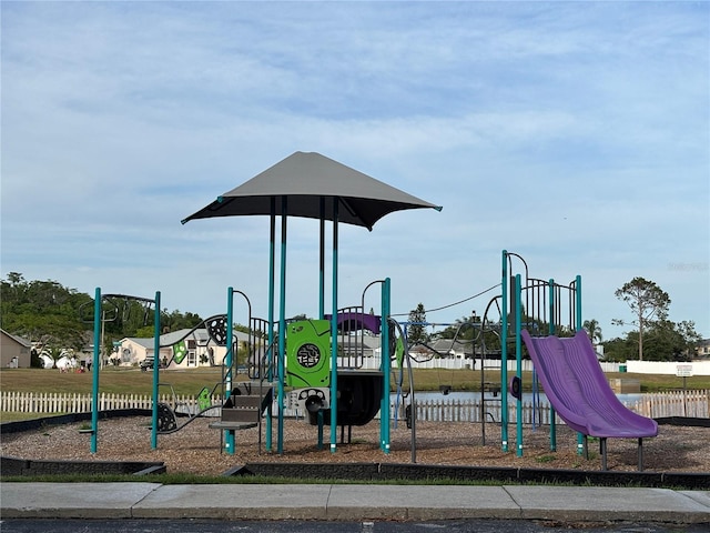 communal playground featuring fence