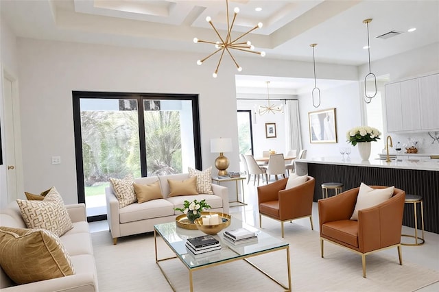 living room featuring visible vents, recessed lighting, and a notable chandelier
