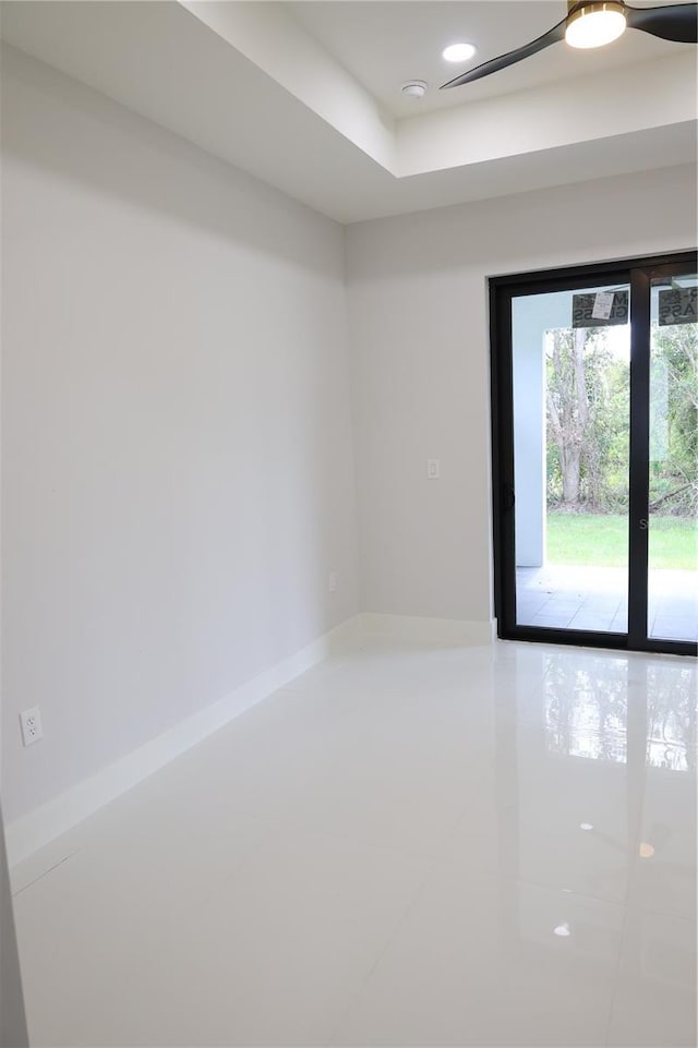 spare room with baseboards, a ceiling fan, tile patterned floors, and recessed lighting