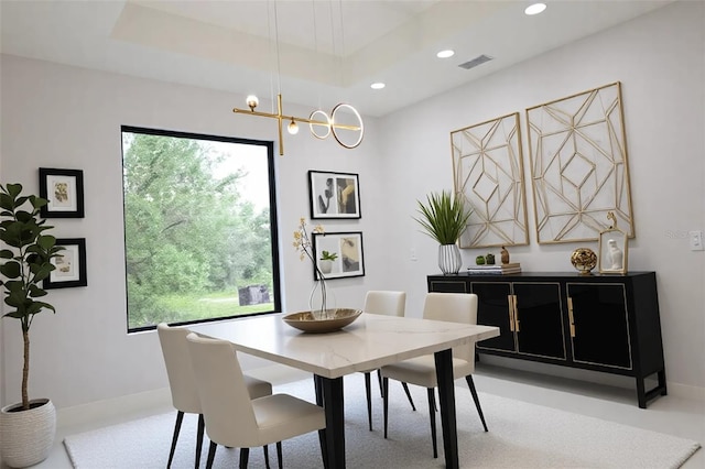 dining room featuring recessed lighting, an inviting chandelier, and plenty of natural light
