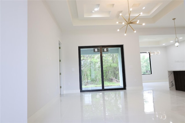 empty room with baseboards, recessed lighting, a raised ceiling, tile patterned floors, and a chandelier