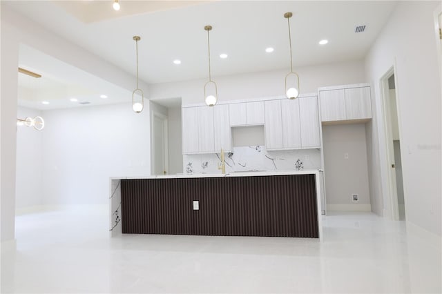 kitchen featuring recessed lighting, modern cabinets, light tile patterned floors, and tasteful backsplash